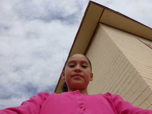 Selfie from a low angle, by Adriana